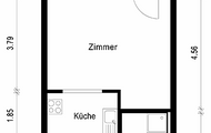 Grundriss einer Einzimmerwohnung zeigt Zimmer mit Balkon, Küche, Bad und Flur in kompaktem Layout.